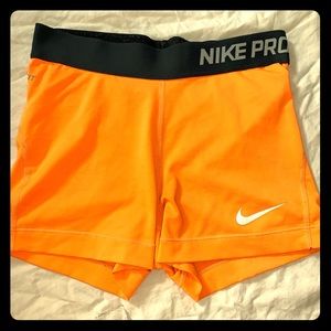 Bright orange Nike Pros